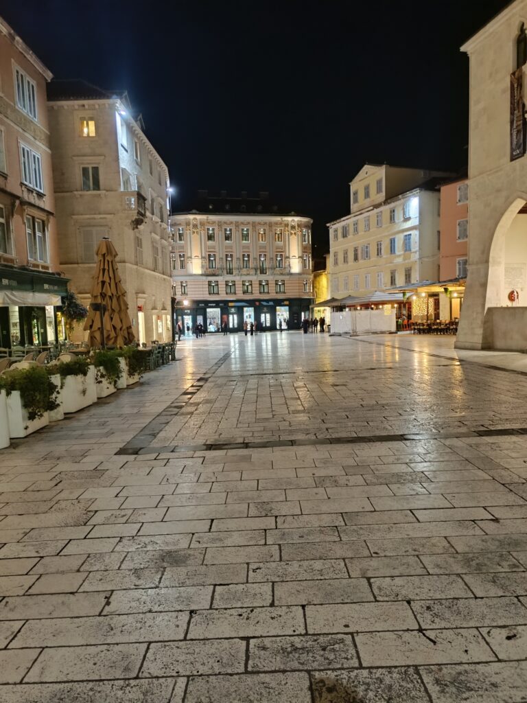 Narodni Trg (Pjaca) in Split at night, illuminated by warm lights and full of historic charm