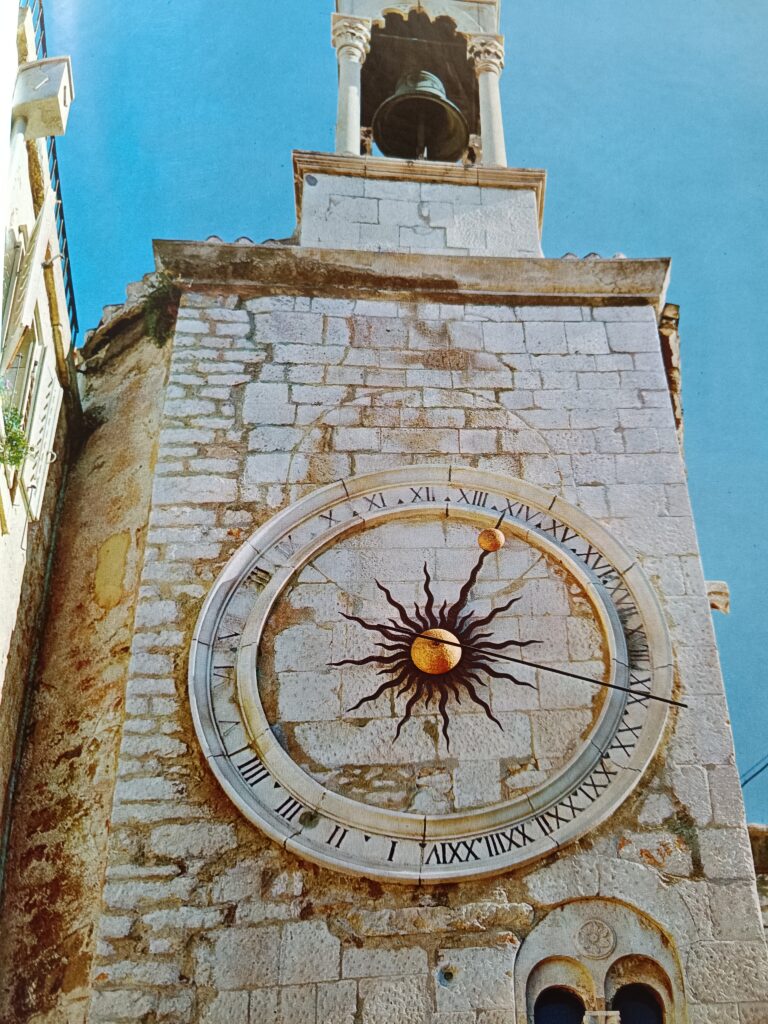 16th - century mechanical clock in Split, featuring Roman numerals carved in stone